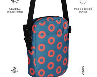 May include: A blue crossbody bag with a pattern of orange circles. The bag has an adjustable shoulder strap, a two-way zipper, and an inside and outside pocket. The bag is made of sturdy fabric.