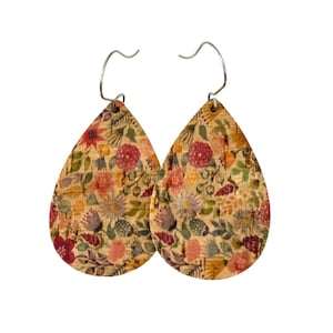 May include: A pair of teardrop-shaped cork earrings with a floral print in shades of pink, red, green, and yellow.