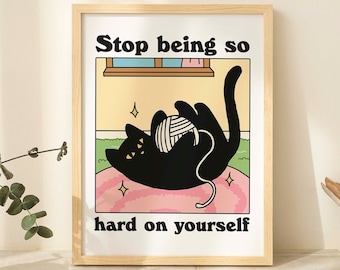 May include: A black cat with yellow eyes is playing with a ball of yarn on a pink and green background. The text "Stop being so hard on yourself" is written in black letters below the cat.