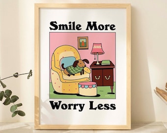 May include: A pink and yellow illustrated print with a dog sitting in a chair. The text "Smile More Worry Less" is at the top and bottom of the image.