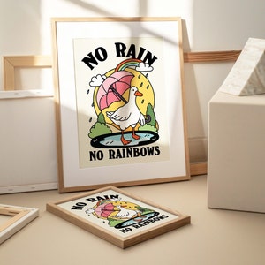 May include: Two framed prints with a cartoon goose holding an umbrella and the text "NO RAIN NO RAINBOWS".