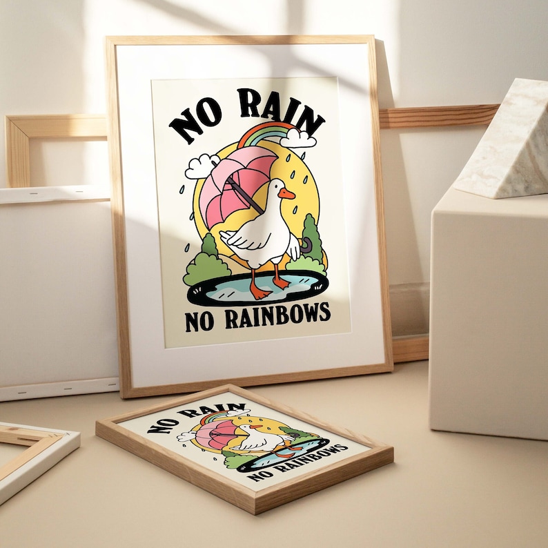 May include: Two framed prints with a cartoon goose holding an umbrella and the text "NO RAIN NO RAINBOWS".
