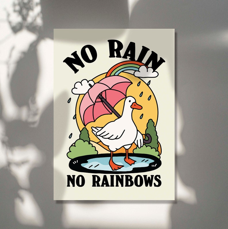 May include: A white duck with a pink umbrella standing in a puddle with a rainbow above it. The text "NO RAIN NO RAINBOWS" is below the duck.