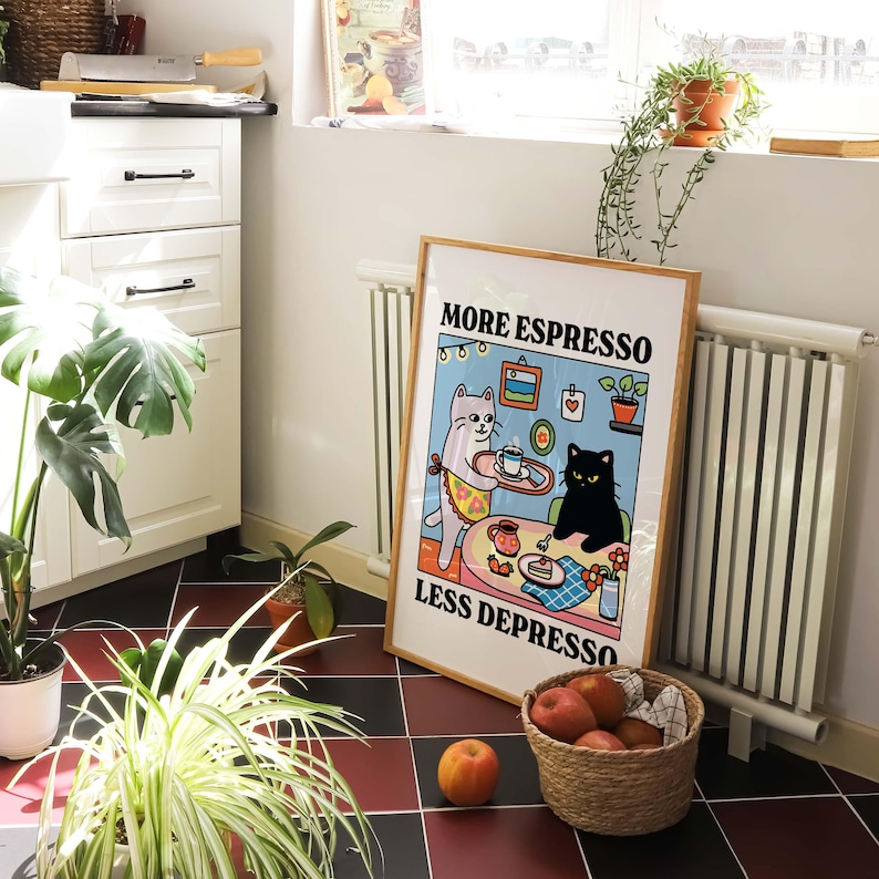 May include: A colorful poster with a white cat and a black cat. The poster has the text "More Espresso Less Depresso" on it.