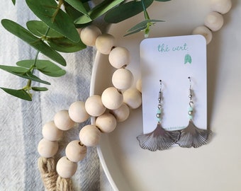 The Ginna Silver Ginkgo Leaf Earrings with faceted pale blue and round silver pearl glass beads