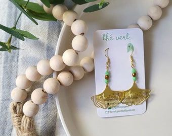 The Ginna Gold Ginkgo Leaf Earrings with faceted green and gold glass beads