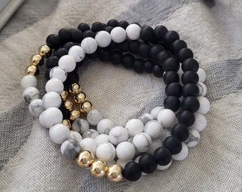 The Simone Stretch Stacking Bracelets with 14K Gold Filled Beads, Matte Black Glass and Round Howlite Beads (Water and Tarnish Resistant)