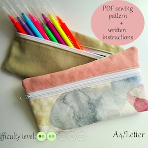 May include: Two zippered pouches, one in a light green fabric and the other in a white fabric with a watercolor design. The pouches are filled with colorful markers. The text on the image reads: "PDF sewing pattern + written instructions" and "Difficulty level: (four green circles)" and "A4/Letter".