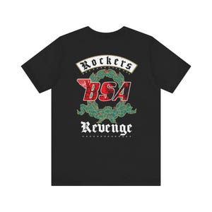 May include: A black short-sleeved t-shirt featuring a graphic on the back. The design includes the text Rockers and Revenge in white, a red BSA logo with a wing, and a green wreath with red berries, all set against a solid black background.
