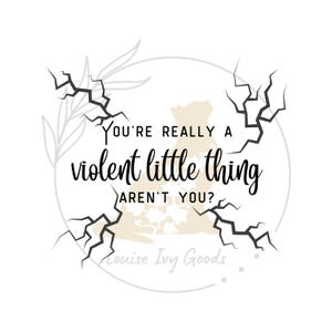 May include: A white circle with a black crack design around the edge. The text inside the circle reads "You're really a violent little thing aren't you?" with the words "Louise Ivy Goods" at the bottom.