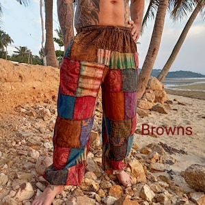 May include: Patchwork pants in various shades of brown, red, blue, and green. The pants have a loose, comfortable fit with an elastic waistband. The word "Browns" is written in red on the bottom right of the image.