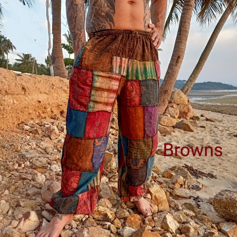 May include: Patchwork pants in various shades of brown, red, blue, and green. The pants have a loose, comfortable fit with an elastic waistband. The word "Browns" is written in red on the bottom right of the image.