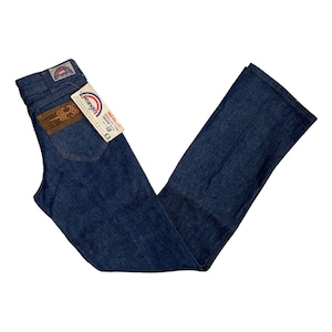 May include: A pair of blue denim jeans with a brown leather patch on the back pocket. The jeans have a Wrangler label and a tag that says "No-Plus Size 100% Cotton Denim Made in USA".