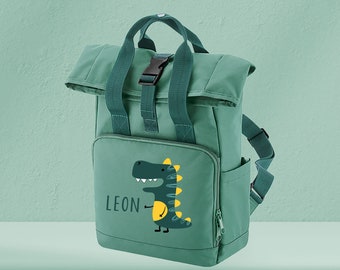 Children's backpack roll-top recycled sage green with name and motif Dino Cartoon