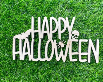 May include: White wooden sign with the words "Happy Halloween" in a decorative font. The sign is on a green grassy surface.