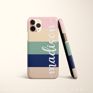 May include: A personalized phone case with a striped design in pink, beige, green, and blue. The name "madison" is written vertically in white on the case.