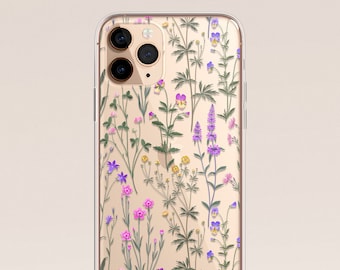 Puede incluir: Una funda transparente para teléfono con un patrón floral. Las flores son rosas, moradas y amarillas. La funda está diseñada para un iPhone.