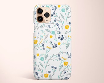 Könnte beinhalten: Eine weiße iPhone-Hülle mit einem Blumenmuster mit blauen, gelben und grauen Blumen und Blättern.
