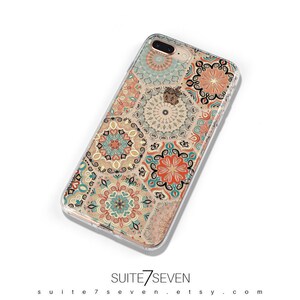 May include: A clear phone case with a colorful mandala pattern. The case is designed for an iPhone and features a variety of colors, including orange, blue, and green.