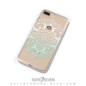 May include: A clear phone case with a white and light green mandala design. The case is designed for an iPhone.