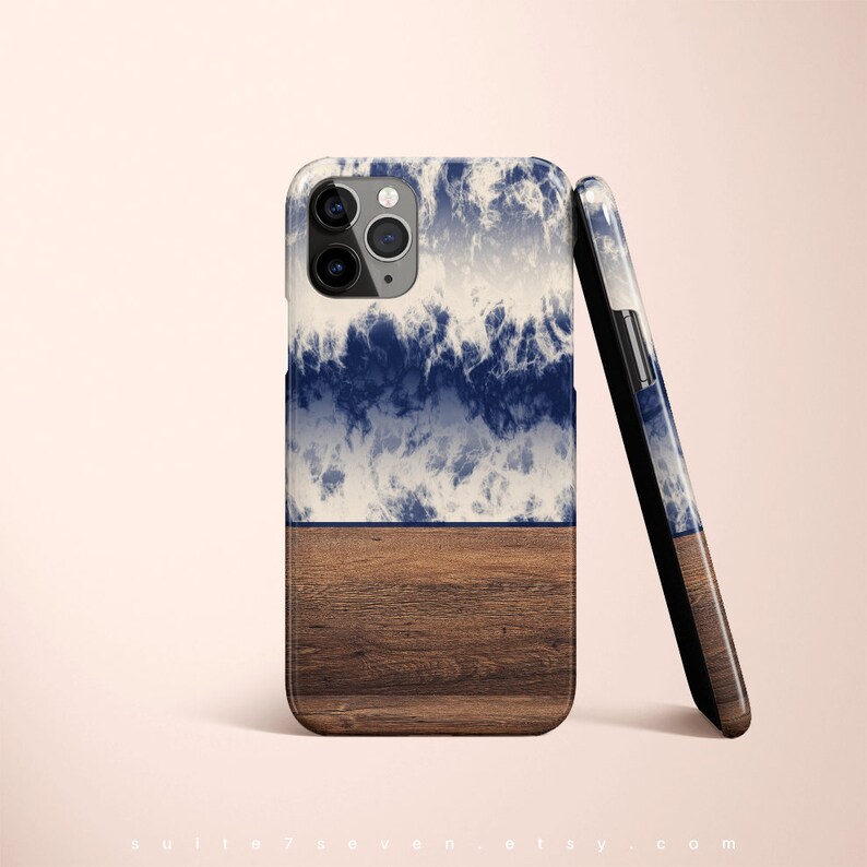 May include: A blue and white abstract design phone case with a wood grain bottom. The case is designed for an iPhone.