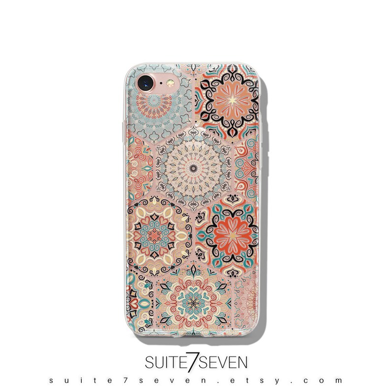 May include: A clear phone case with a colorful mandala pattern. The case is designed for an iPhone and features a variety of intricate designs in shades of blue, orange, and pink.