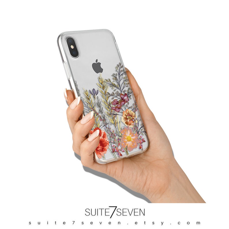 May include: Clear phone case with a floral design featuring pressed flowers in shades of pink, orange, and yellow. The flowers are arranged in a vertical pattern on the back of the case.