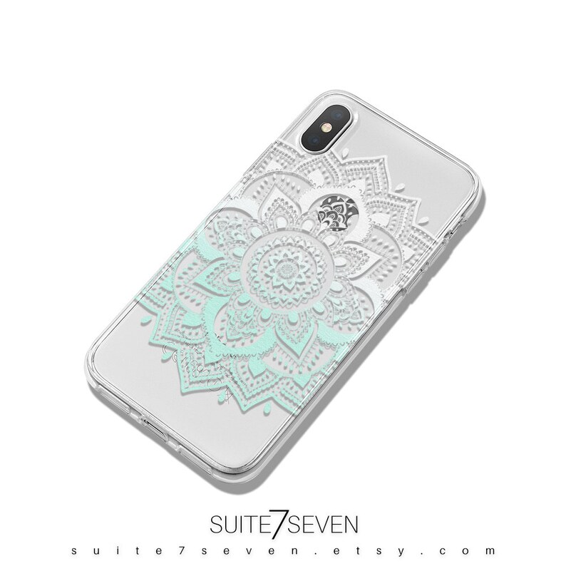 May include: A clear phone case with a white and light blue mandala design. The case is designed for an iPhone X.