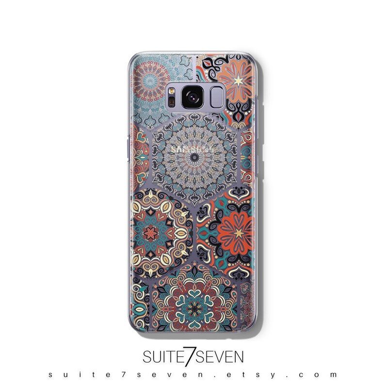 May include: A clear phone case with a colorful mandala pattern. The case is designed for a Samsung Galaxy phone. The pattern features a variety of colors, including blue, green, red, orange, and yellow.