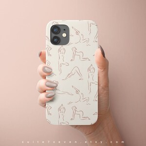 May include: White phone case with a pattern of brown line drawings of people in yoga poses.