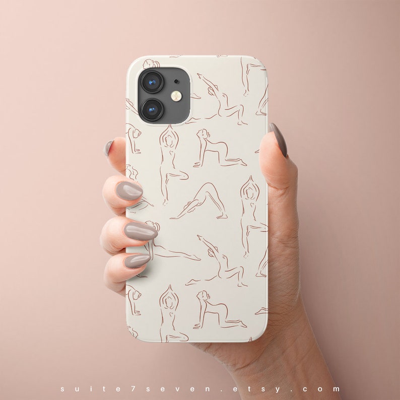 May include: White phone case with a pattern of brown line drawings of people in yoga poses.