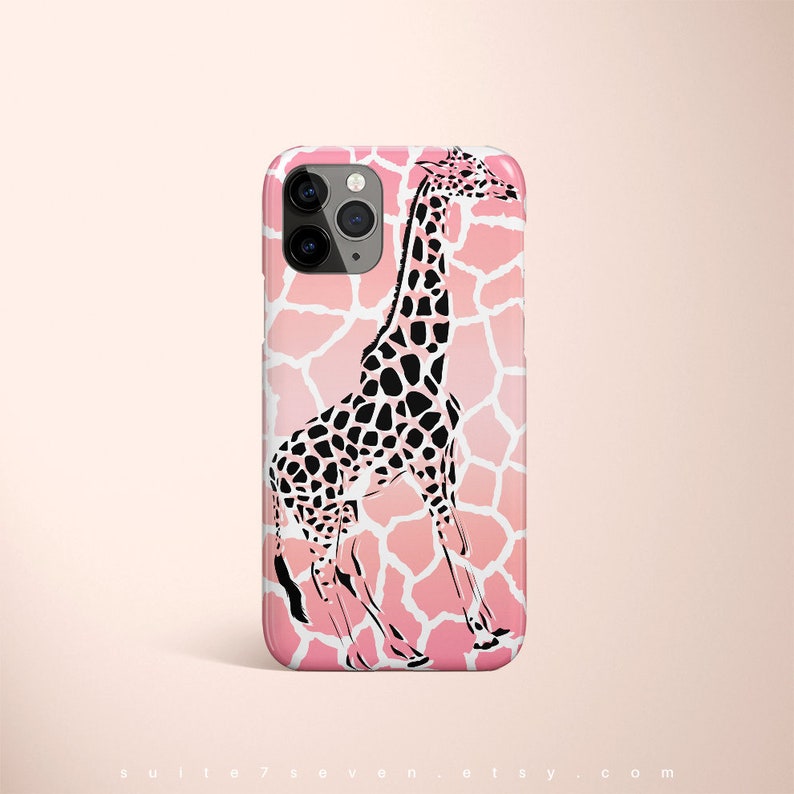 May include: Pink iPhone case with a black and white giraffe silhouette on a pink and white giraffe print background.