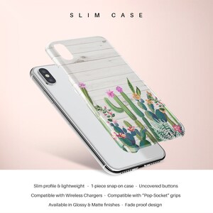 May include: A clear phone case with a white woodgrain background and a colorful cactus design. The case is slim and lightweight, and it has a one-piece snap-on design. It is compatible with wireless chargers and PopSocket grips. The case is available in glossy and matte finishes and is fade-proof.