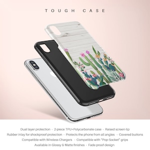 May include: A tough case for a phone with a white woodgrain background and a cactus design. The case is made of two pieces, TPU and polycarbonate, and has a raised screen lip for protection. It is compatible with wireless chargers and pop sockets.