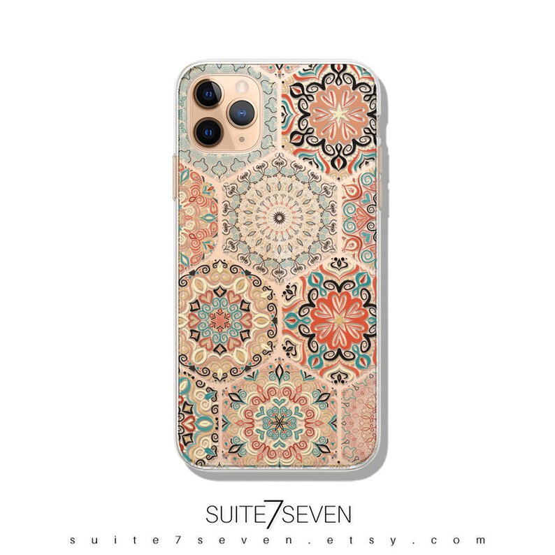May include: A clear phone case with a colorful geometric pattern featuring hexagonal shapes and intricate designs in shades of orange, blue, and green. The case is designed for an iPhone.