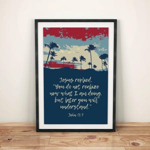 May include: Framed art print featuring a stylized tropical scene with palm trees under a red, blue, and beige sky. The print includes the quote "You do not realize now what I am doing, but later you will understand." from John 13:7.