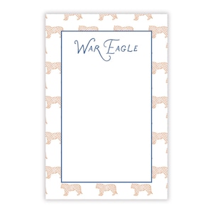 May include: A rectangular notepad featuring a white background with a repeating pattern of orange tigers. The center contains a large white rectangular space bordered by a thin blue line, with the text War Eagle written in blue script.