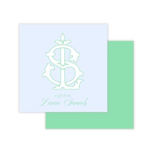 May include: Square light blue gift tag with a mint green monogram and the text "a gift from, Laura Samuels." A mint green envelope is behind the gift tag. The monogram is a stylized "S" and "L".