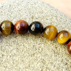 Force bracelet, multicolored tiger eye, bronze Buddha bead image 7