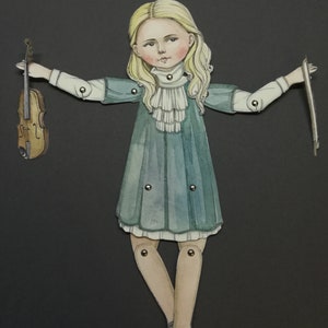 May include: A paper doll illustration of a girl in a teal dress, holding a violin and bow. The doll has blonde hair and is jointed at the arms and legs. The background is a solid black.