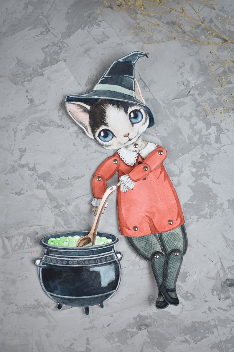 May include: A black and white cat wearing a witch's hat and red dress stirs a green potion in a black cauldron with a wooden spoon.