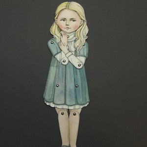 May include: A watercolor illustration of a paper doll with blonde hair and a teal dress. The doll has articulated joints and is posed with hands near the face. The background is a solid dark gray.