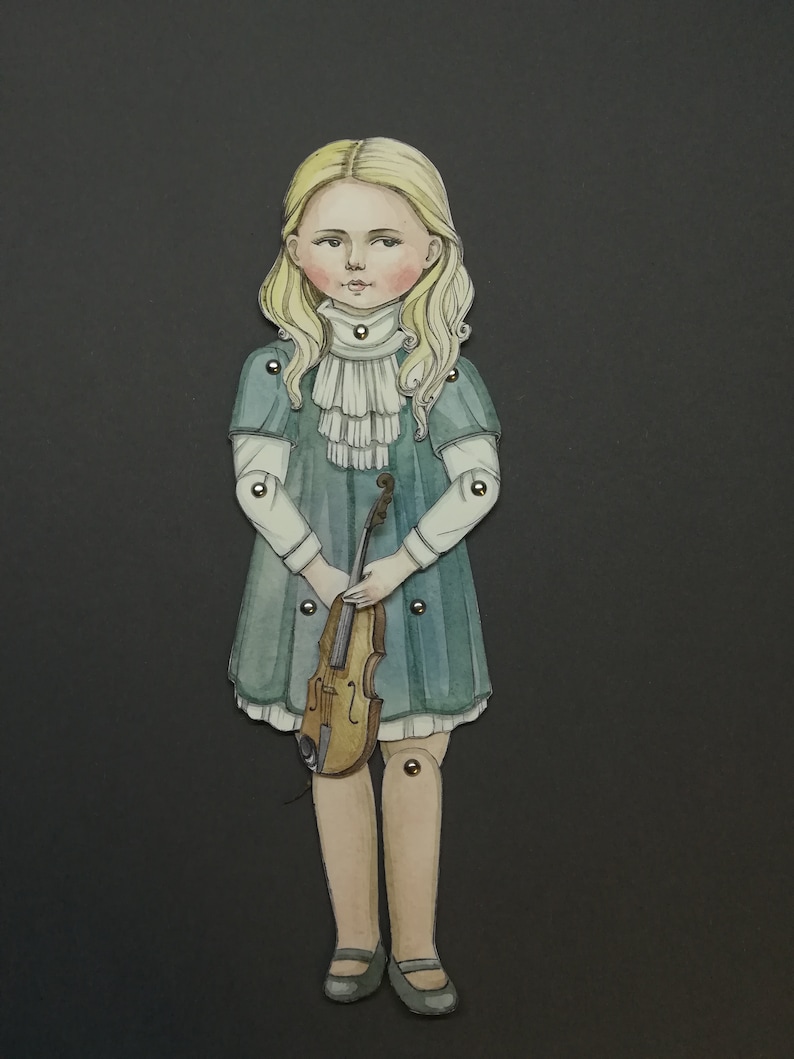 May include: Watercolor illustration of a paper doll girl with blonde hair, wearing a teal dress and holding a violin. The doll has articulated joints and is set against a dark gray background. The doll's dress has a white ruffled collar.