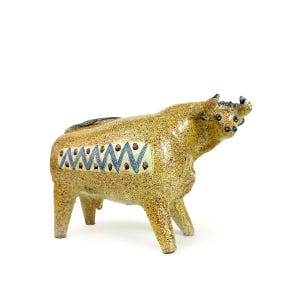 May include: A handmade wooden chopping board with a natural finish. The rectangular board has a juice groove and a handle. Dimensions are approx. 45 cm long, 30 cm wide, and 2.5 cm thick.