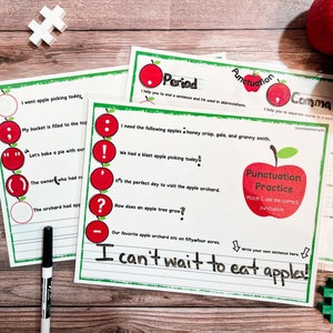 Peut inclure: Une feuille de travail imprimable avec des exercices de ponctuation sur le thème de la pomme. La feuille de travail présente des pommes rouges avec différents signes de ponctuation. Le texte sur la feuille de travail comprend des phrases sur la cueillette des pommes et les différents types de pommes. La feuille de travail comprend également une section pour que les élèves puissent écrire leurs propres phrases.