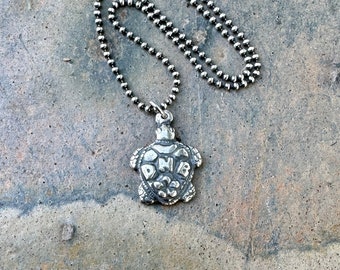 David Nelson Band turtle pendant