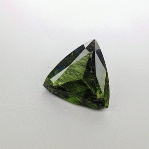 Rutile peridot Gem Peridot containing hairlike inclusions Ludwigite from Mansehra KP Pakistan, 13.5 carats
