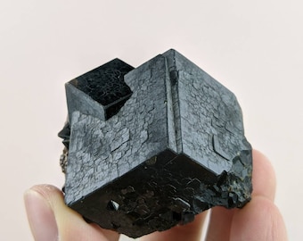 Dark brown Andradite garnet. Excellent luster and polish. Well formed crystal, 127 grams