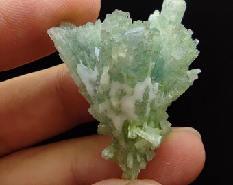 Natural light green tourmaline cluster with blue hue Inside from Afghanistan, 12.8 grams