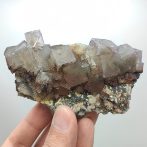 Natural light purple cubic perfectly terminated phantom fluorite crystal with dogtooth calcite on matrix from Baluchistan Pakistan, 238 gram